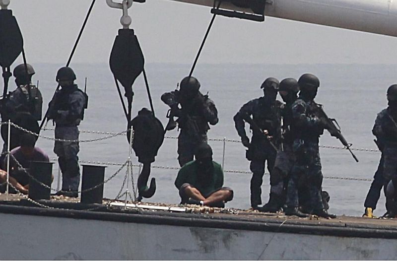 Members of the Philippine Coast Guard (PCG) anti-terrorist unit apprehend mock pirates who hijacked a vessel during a maritime exercise at a bay in Manila May 6, 2015. u00e2u20acu201d Reuters pic 