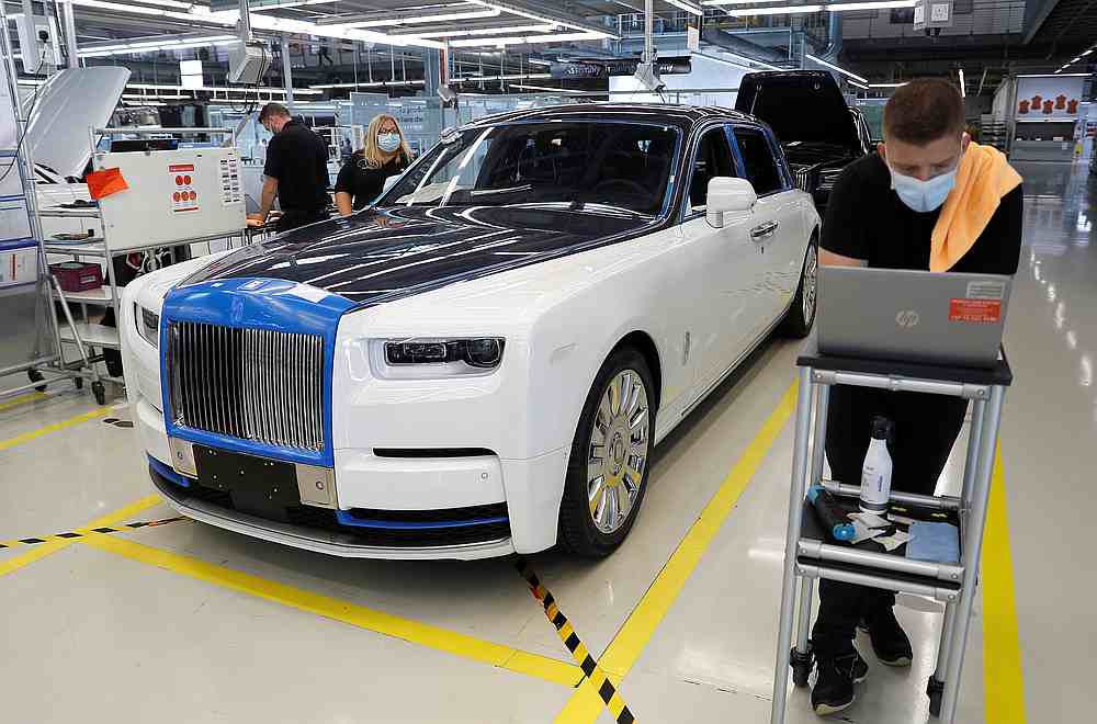 Technicians inspect a Rolls-Royce a car on the production line of the Rolls-Royce Goodwood factory, near Chichester, Britain September 1, 2020. u00e2u20acu201d Reuters pic
