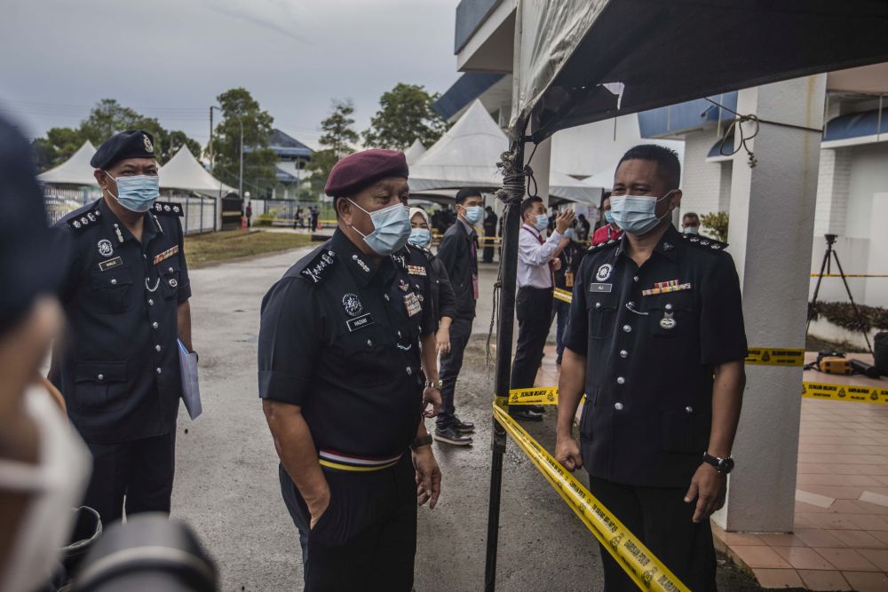 Sabah Police Commissioner Datuk Hazani Ghazali (centre) observes early voting for the Sabah state poll in Kota Kinabalu September 22, 2020. u00e2u20acu201d Picture by Firdaus Latif