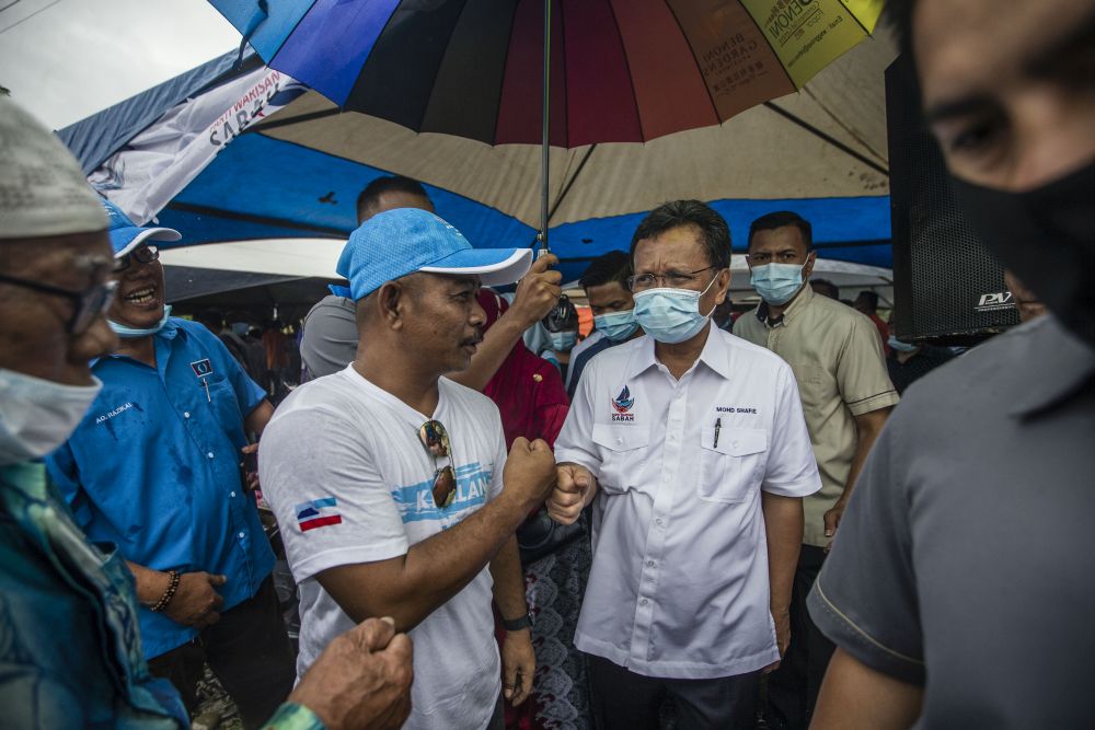 Parti Warisan Sabah president Datuk Seri Mohd Shafie Apdal greets supporters while campaigning in Pintasan, Kota Belud September 16, 2020. u00e2u20acu201d Picture by Firdaus Latif