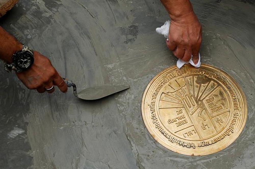 Student leaders install a plaque declaring u00e2u20acu02dcThis country belongs to the peopleu00e2u20acu2122 during a mass rally to call for the ouster of Prime Minister Prayuth Chan-ocha and reforms in the monarchy, near the Grand Palace in Bangkok, Thailand, September 20, 2020.