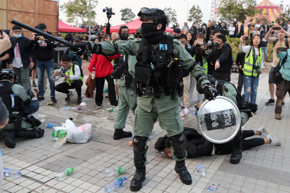 A riot policeman detains a protester after a Chinese flag was removed from a flag pole at a rally in support of Xinjiang Uighursu00e2u20acu2122 human rights in Hong Kong, China, December 22, 2019. u00e2u20acu201d Reuters pic 