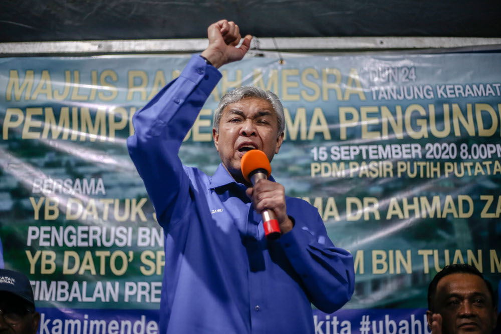 BN chairman Datuk Seri Ahmad Zahid Hamidi speaks while campaigning for Shahelmey Yahaya, BN Tanjung Keramat candidate in Tanjung Keramat, Sabah September 15, 2020. u00e2u20acu201d Picture by Firdaus Latif