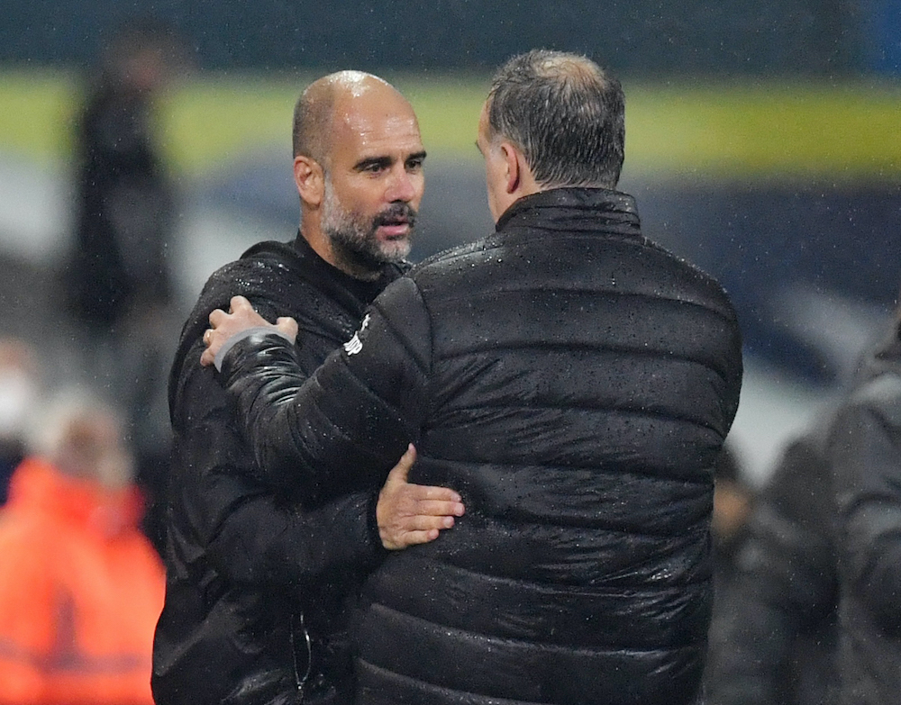 Leeds United manager Marcelo Bielsa with Manchester City manager Pep Guardiola after the match, October 3, 2020. u00e2u20acu201d Pool via Reuters/Paul Ellis 