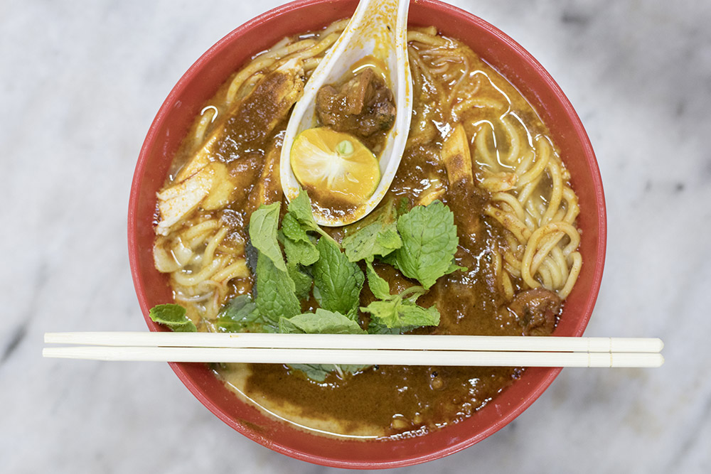 A big bowl of 'curry mee', with extra cockles.