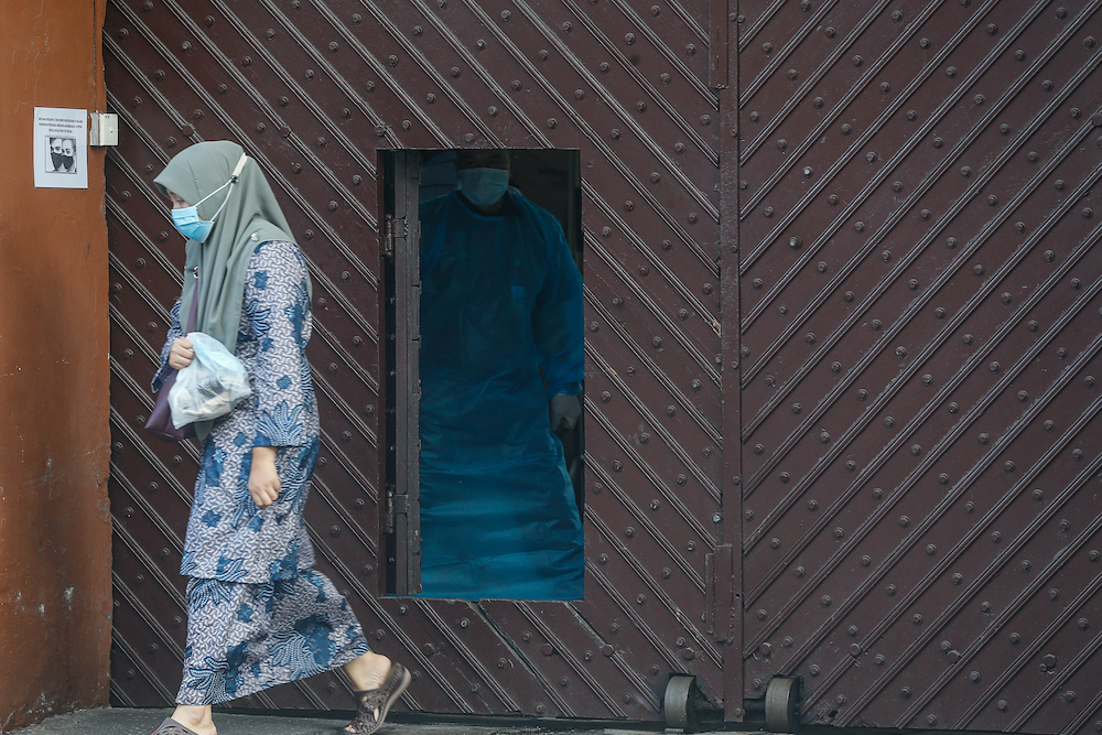 A man in a PPE suit is seen at the Penang Remand Prison along Jalan Penjara, October 6. 2020. u00e2u20acu201d Picture by Sayuti Zainudin