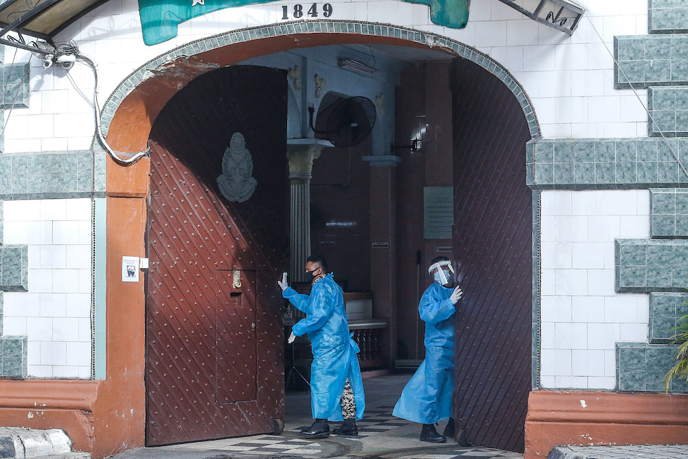 Staff at the Penang Remand Prison are seen in PPE suits after an inmate was confirmed to have contracted the Covid-19 virus, October 6. 2020. u00e2u20acu201d Picture by Sayuti Zainudin