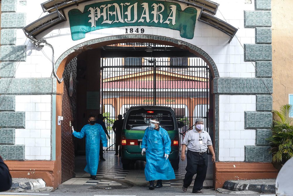 Staff at the Penang Remand Prison are seen in PPE suits after an inmate was confirmed to have contracted the Covid-19 virus, October 6. 2020. — File picture by Sayuti Zainudin