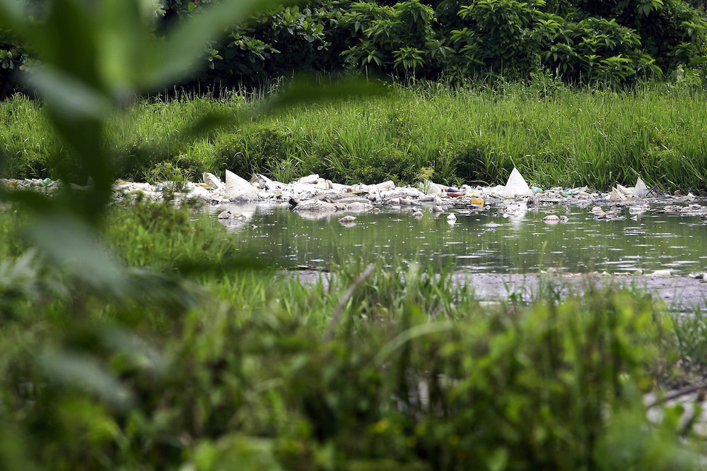 Rubbish is seen floating on Sungai Batang Benar in Nilai, October 6, 2020. u00e2u20acu201d Bernama pic