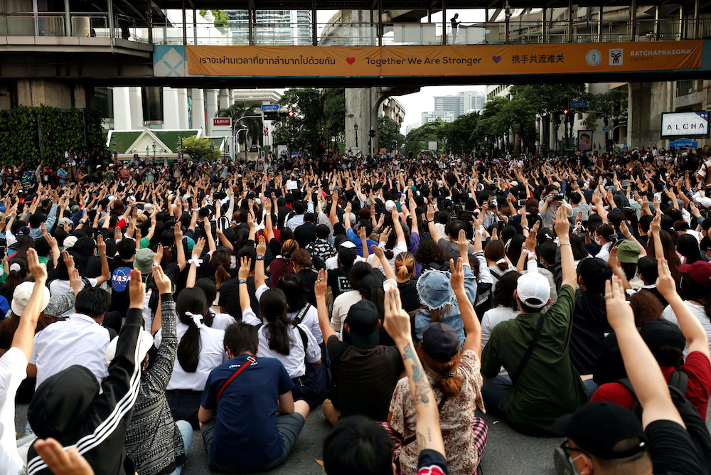 Pro-democracy protesters show the three-finger salute as they gather demanding the government to resign and to release detained leaders in Bangkok, Thailand October 15, 2020. u00e2u20acu201d Reuters pic