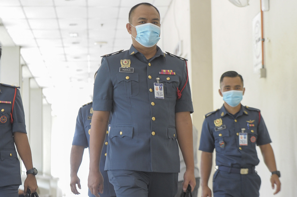 Fire and Rescue Department operations commander Ahmad Mukhlis Mukhtar (centre) is pictured at Seremban Court complex October 20, 2020. u00e2u20acu2022 Picture by Shafwan Zaidon