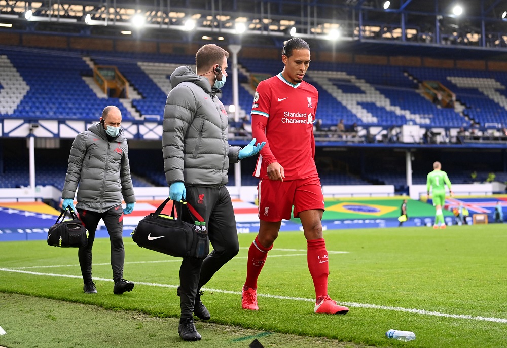 Liverpool's Virgil van Dijk receives medical attention after sustaining an injury during their match at Goodison Park in Liverpool October 17, 2020. u00e2u20acu201d Pool pic via Reuters