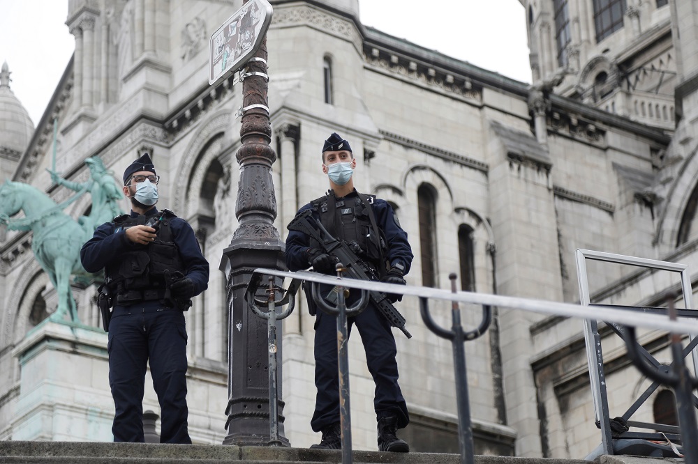 French CRS riot policemen stand guard in front of the Sacre-Coeur basilica of Montmartre in Paris as France has raised the security alert for French territory to the highest level after the knife attack in Nice October 30, 2020. u00e2u20acu201d Reuters pic