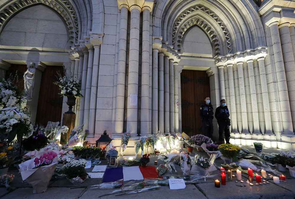 Candles, flowers and messages are seen in front of the Notre Dame church in tribute to the victims of a deadly knife attack in Nice October 30, 2020. — Reuters pic