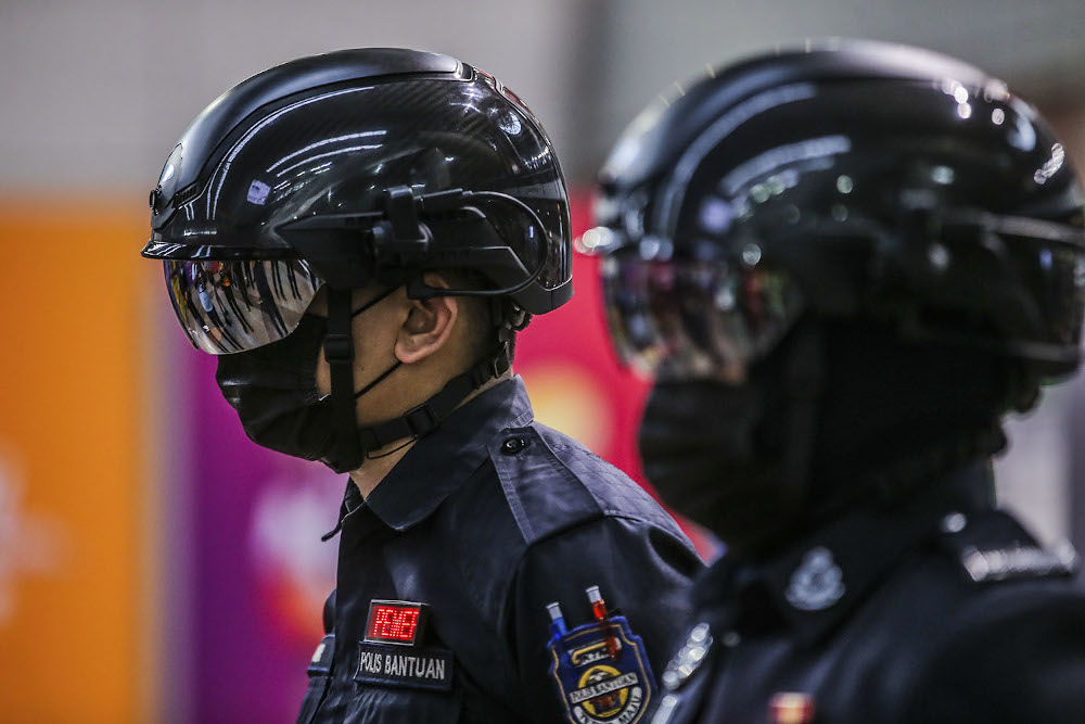 A general picture of the KTMB auxiliary police wearing temperature scanner helmets to patrol its station and trains during the CMCO in KL Sentral October 14, 2020. u00e2u20acu201d Picture by Hari Anggara