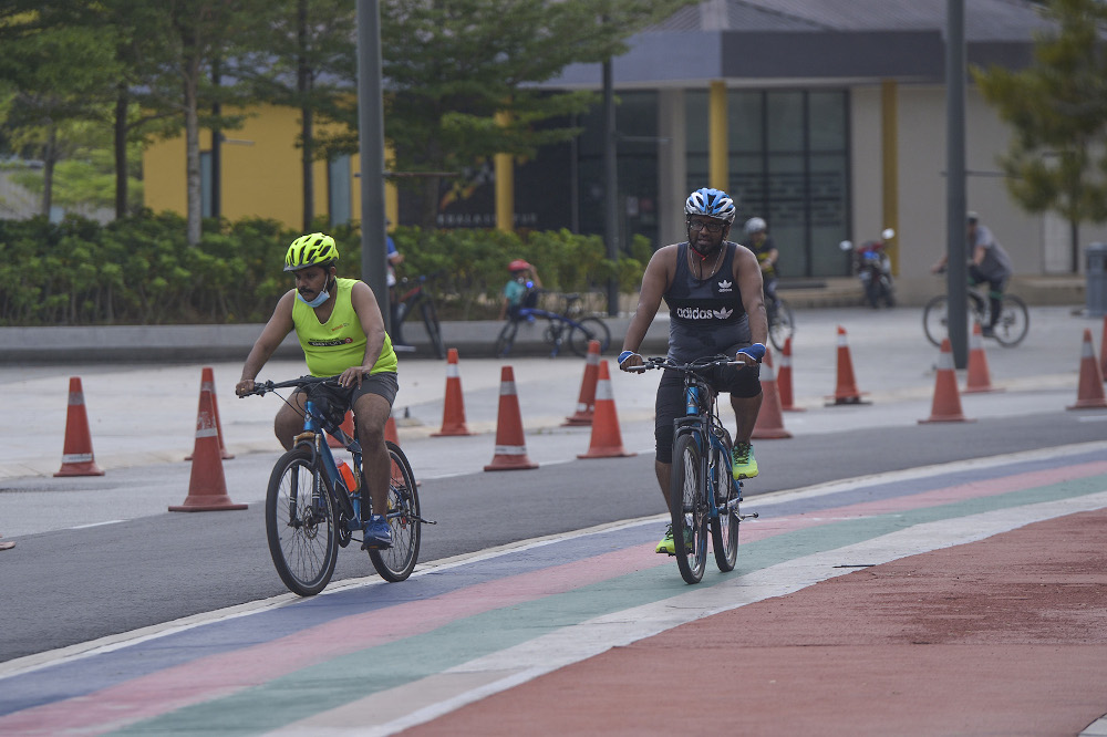 Cyclists are seen at Bukit Jalil Stadium during the conditional movement control order on October 14, 2020. u00e2u20acu201d Picture by Miera Zulyana