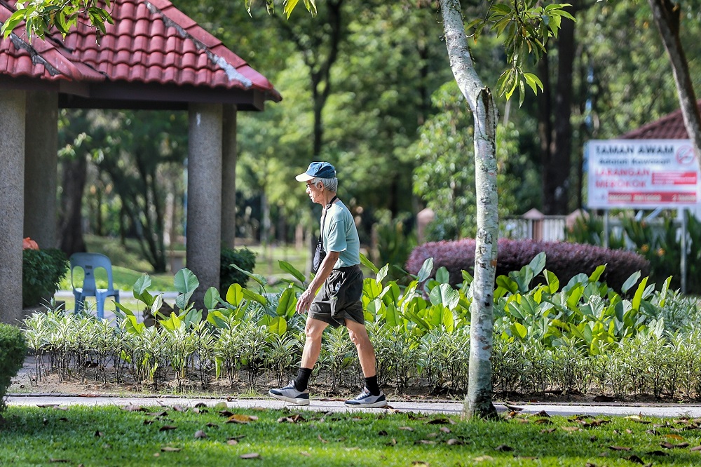A man exercises at Taman Rimba Kiara in Kuala Lumpur during the CMCO period October 19, 2020. u00e2u20acu201d Picture by Ahmad Zamzahuri