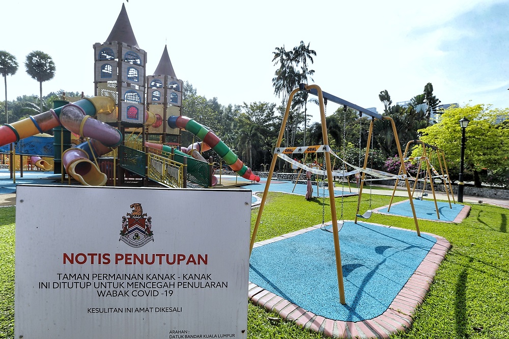 A closure notice is seen at the playground area of Taman Botani Perdana in Kuala Lumpur October 19, 2020. 