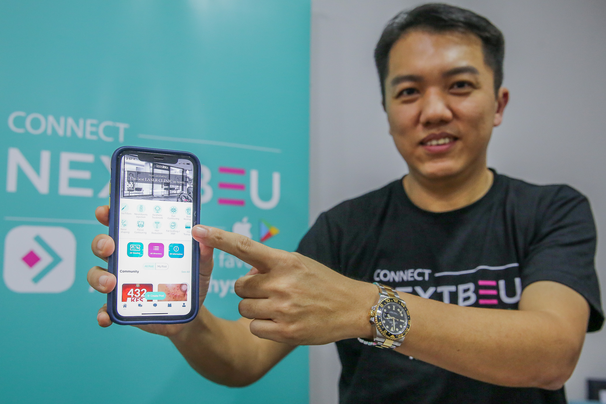 Cosderm Sdn Bhd sales director Tom Goh unveils NextBeu mobile application. u00e2u20acu201d Picture by Yusof Mat Isa
