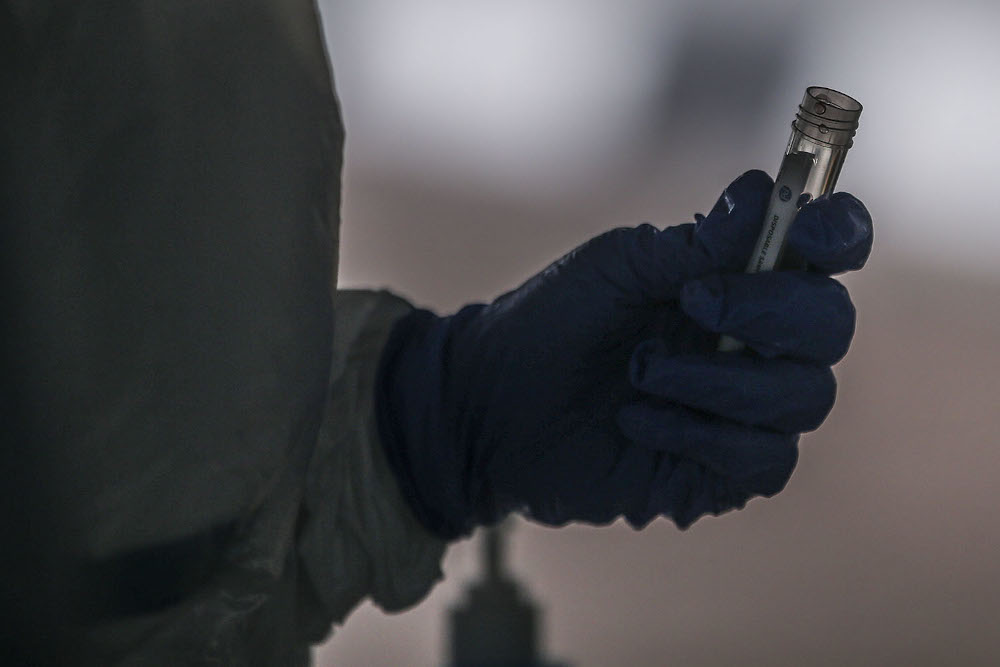 Healthcare workers carry out Covid-19 screening in Kuala Lumpur October 21, 2020. u00e2u20acu201d Picture by Hari Anggara