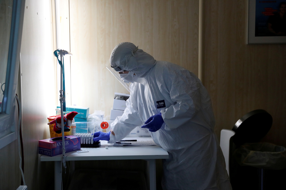 A healthcare worker works at a Covid-19 testing site as the spread of the coronavirus disease (Covid-19) continues in Budapest, Hungary, October 27, 2020. u00e2u20acu201d Reuters pic