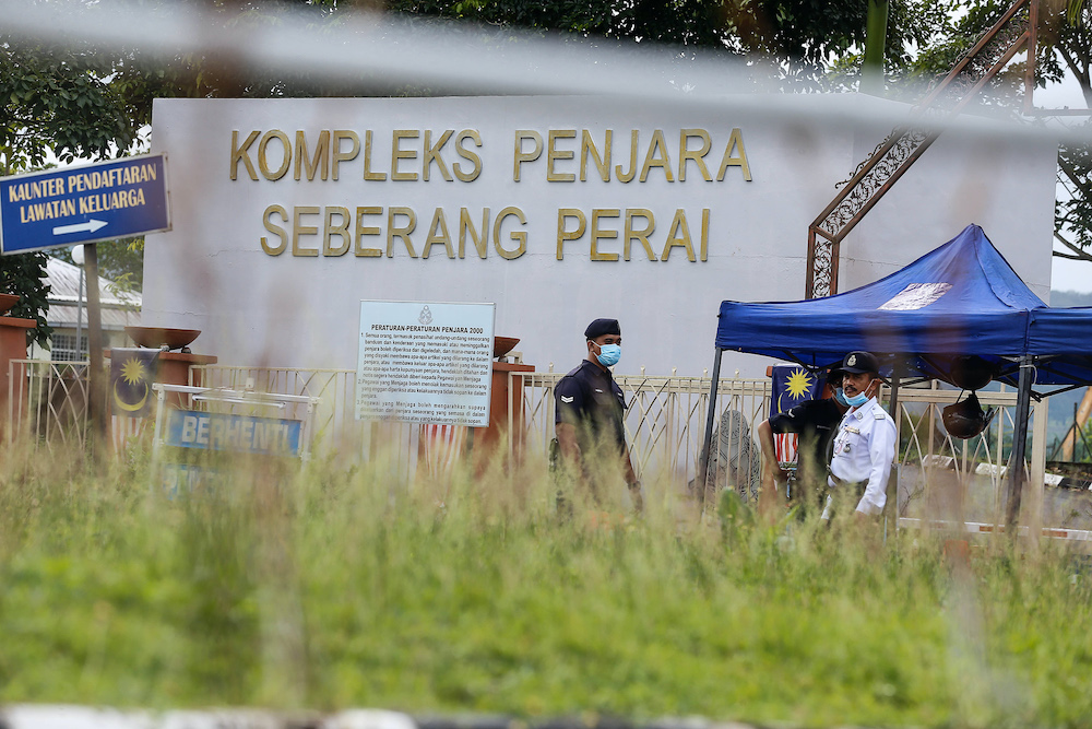 Police put up a roadblock at the entrance to the Seberang Perai Prison Quarters after the implementation of the enhanced movement control order at Seberang Perai Prison, Nibong Tebal October 22, 2020. u00e2u20acu201d Picture by Sayuti Zainudin