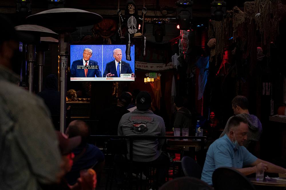 A television screen broadcasts the second 2020 presidential campaign debate between Democratic presidential nominee Joe Biden and US President Donald Trump at The Abbey Bar in West Hollywood, California October 22, 2020. u00e2u20acu201d Reuters pic 