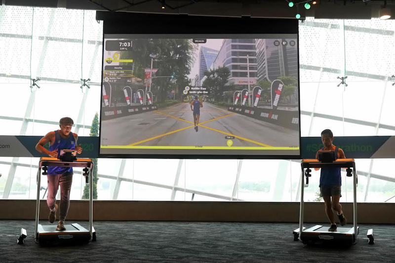 On the screen, the avatars of Lim Teck Yin (left), chief executive officer of Sport Singapore, and Keith Tan (right), CEO of Singapore Tourism Board, run through Orchard Road. u00e2u20acu201d TODAY pic
