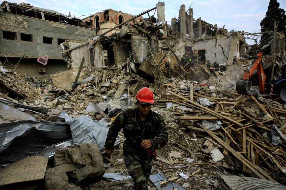 Search and rescue teams work on the blast site hit by a rocket during the fighting over the breakaway region of Nagorno-Karabakh in the city of Ganja, Azerbaijan October 11, 2020. u00e2u20acu201d Reuters pic 