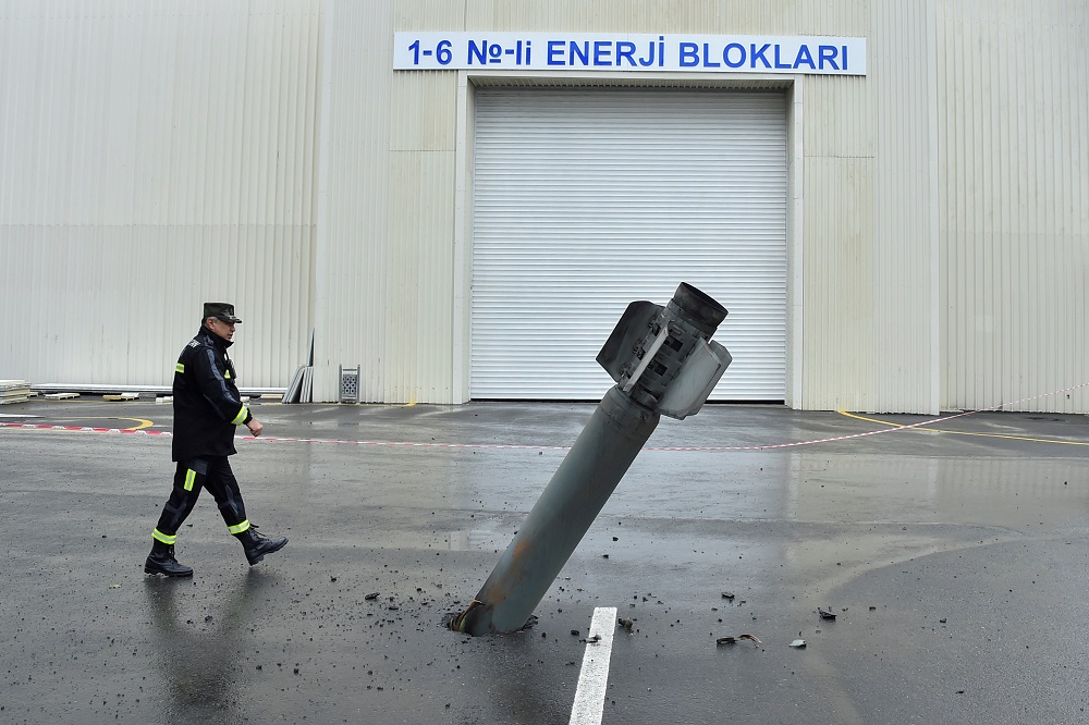 A sapper works next to an unexploded BM-30 Smerch rocket allegedly fired by Armenian forces in the fighting over the breakaway region of Nagorno-Karabakh in the town of Mingachevir, Azerbaijan October 5, 2020. u00e2u20acu2022 Reuters pic