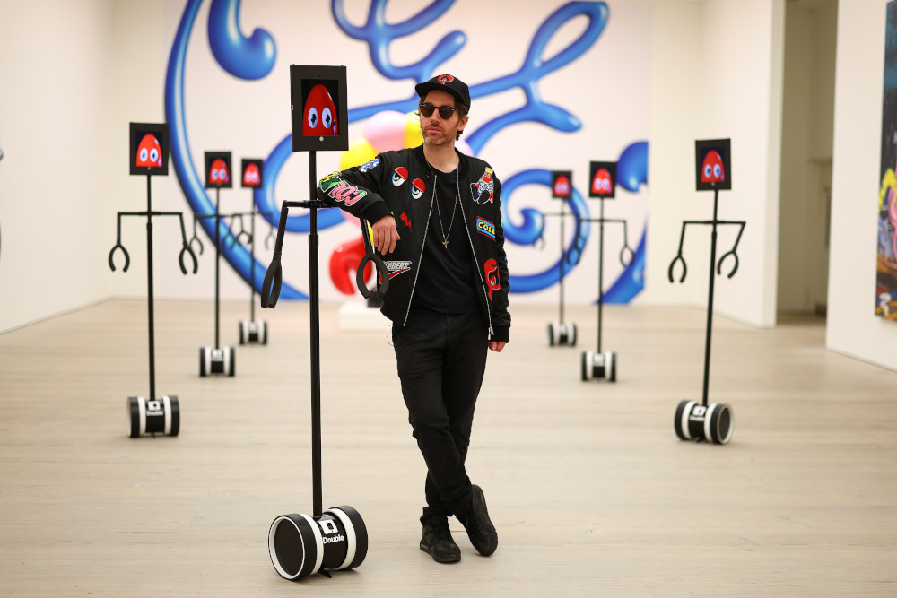 Philip Colbert poses for a photograph with robots at the Saatchi Gallery in London, Britain, October 28, 2020. — Reuters pic 