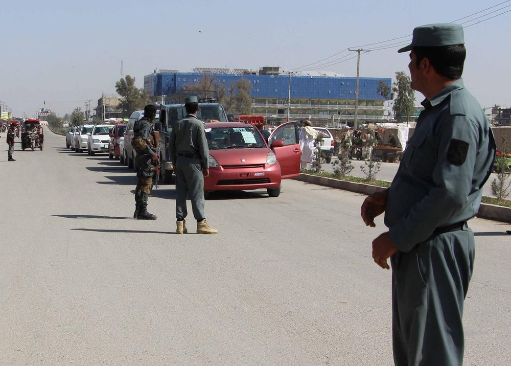 File picture shows Afghan policemen inspecting vehicles at a checkpoint in Helmand province, Afghanistan, February 28, 2017. u00e2u20acu201d Reuters pic