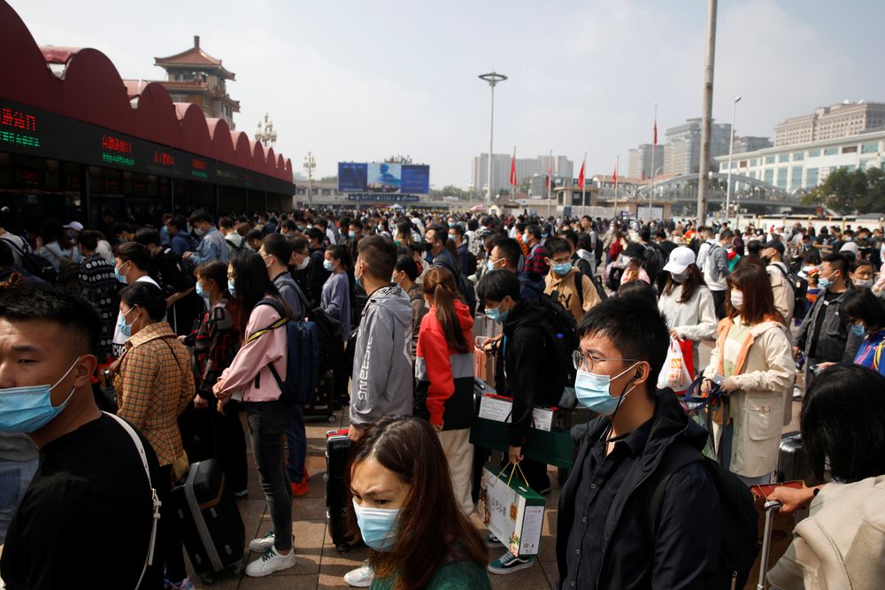 People wearing masks following the coronavirus disease outbreak line up to enter Beijing Railway Station, during the holidays of Mid-Autumn Festival and National Day, in China October 1, 2020. u00e2u20acu201d Reuters pic