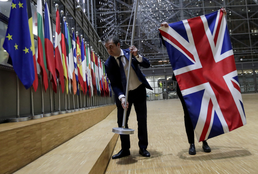 Officials remove the British flag at European Union Council in Brussels, Belgium January 31, 2020. u00e2u20acu201d Reuters pic 