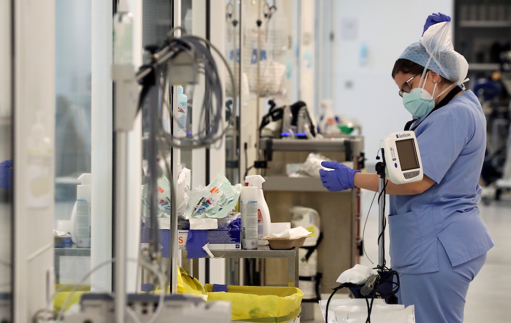 A member of the medical personnel wears a protective mask and a protective suit, following the outbreak of the coronavirus disease, at the CHIREC Delta hospital, in Brussels, Belgium October 23, 2020. u00e2u20acu2022 Reuters picnnn