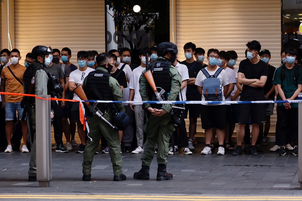 Riot police officers detain people during a protest urging the release of twelve Hong Kong activists detained on the Chinese mainland, who were arrested at sea after attempting to flee to Taiwan, on Chinese National Day in Hong Kong October 10, 2020. u00e2u20acu2022 