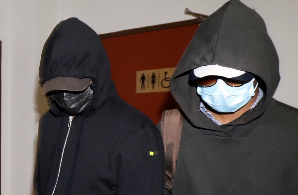 Former senior general manager of FGV Holdings Berhad Norazam Abdul Hameed (left) at the Sessions Court in Shah Alam October 21, 2020. u00e2u20acu201d Bernama pic