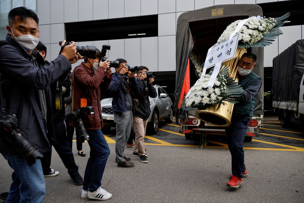 A wreath of flowers from South Koreau00e2u20acu2122s National Assembly Speaker Park Byeong-seug is carried by a worker outside a funeral parlour where the funeral of Lee Kun-hee, leader of Samsung Group, will take place, in Seoul, October 25, 2020. u00e2u20acu201d Reuters pic