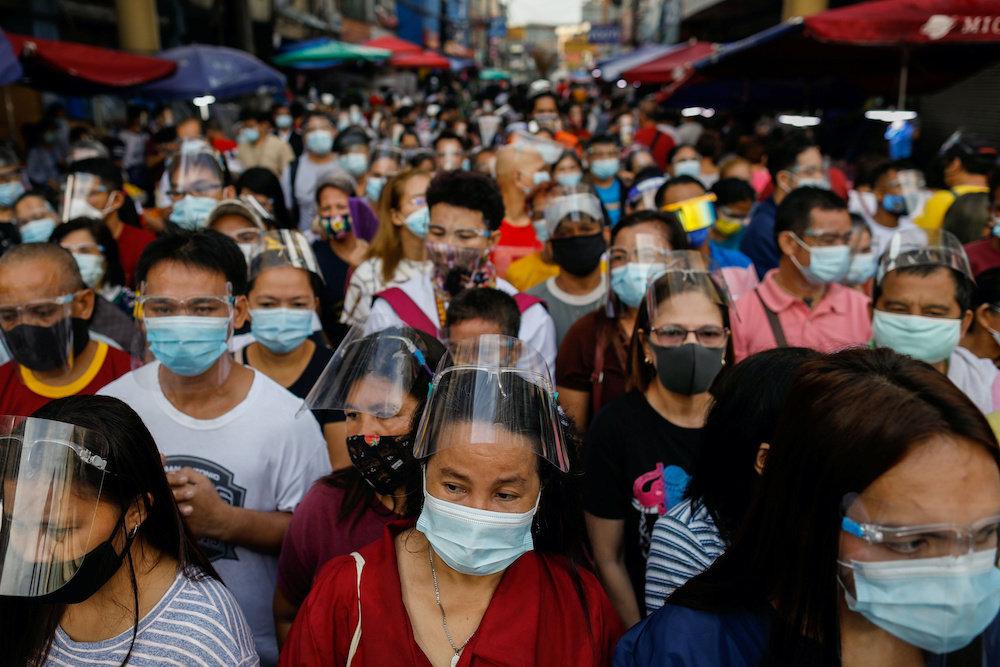 Filipino devotees flock outside the Minor Basilica of the Black Nazarene to catch the first Friday mass of the month, amid the coronavirus disease outbreak, in Quiapo, Manila, Philippines, October 2, 2020. u00e2u20acu2022 Reuters picnnn