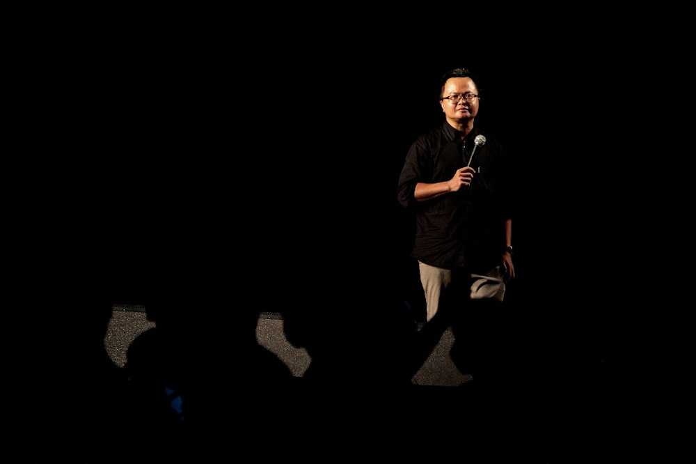 Human rights lawyer Anon Numpa addresses a crowd of pro-democracy protesters during an anti-government rally next to Government House in Bangkok on October 14, 2020. u00e2u20acu201d AFP pic