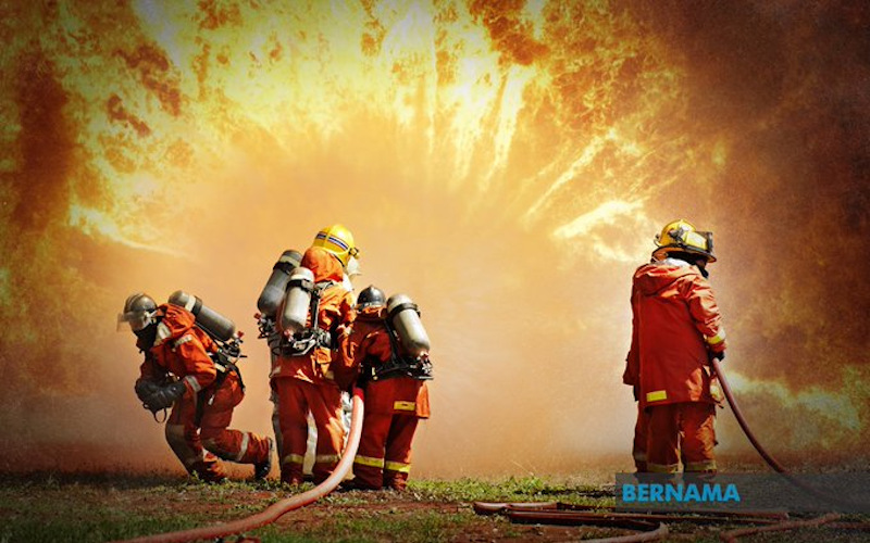 Penang Fire and Rescue Department personnel fighting a fire caused by a chemical spill at a factoryu00e2u20acu2122s laboratory in Bayan Lepas Industrial Area, Penang October 2, 2020. u00e2u20acu201d Picture via Twitter/Bernama