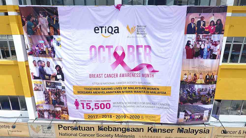 Unveiling of the giant banner In conjunction with the Breast Cancer Awareness Month at the NCSM building. u00e2u20acu201d Picture via Facebook/ National Cancer Society Malaysia