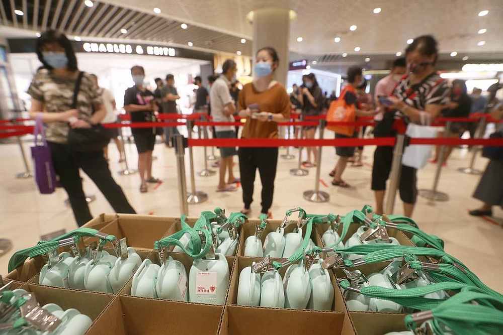 People collecting their TraceTogether tokens in Bedok Mall in Singapore October 4, 2020. u00e2u20acu201d TODAY pic