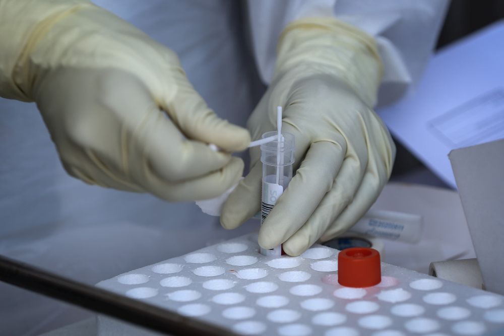 A healthcare worker collects swab samples to test for Covid-19 at BP Healthcare in Klang October 27, 2020. u00e2u20acu201d Picture by Yusof Mat Isa