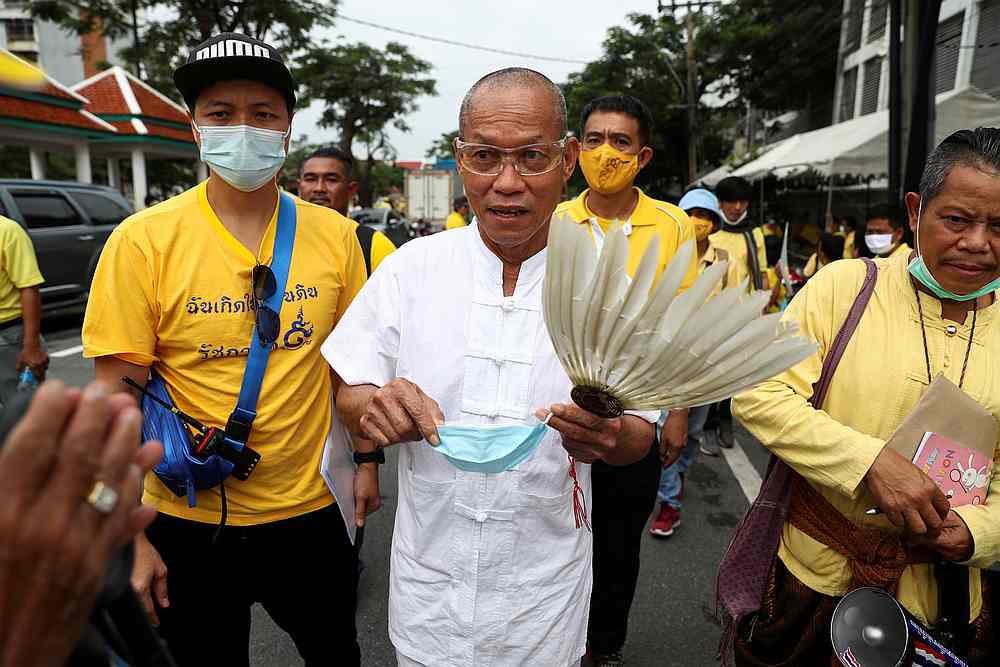 Former monk Buddha Issara, a Royalist leader, holds a face mask near the Royal Plaza in Bangkok, Thailand October 14, 2020. u00e2u20acu201d Reuters pic