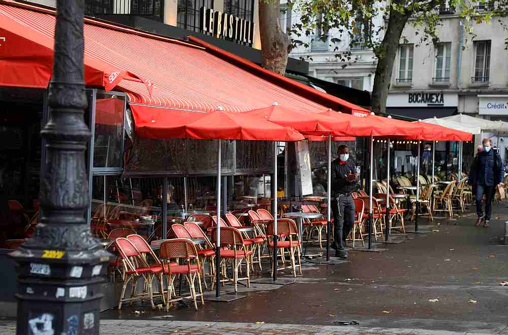 A waiter, wearing a protective face mask, waits for customers on the terrace of a restaurant at the Place de la Bastille in Paris, France October 13, 2020. u00e2u20acu201d Reuters pic