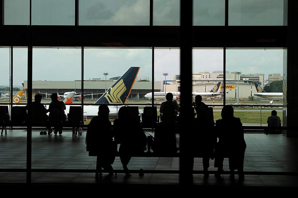 People look at a Singapore Airlines plane, amid the spread of Covid-19, at a viewing gallery of the Changi Airport in Singapore October 12, 2020. u00e2u20acu201d Reuters pic