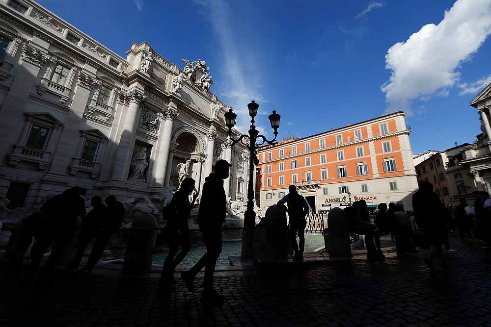 People wearing protective masks walk in front of the Trevi's Fountain, amid the Covid-19 outbreak in Rome, Italy October 13, 2020. u00e2u20acu201d Reuters pic