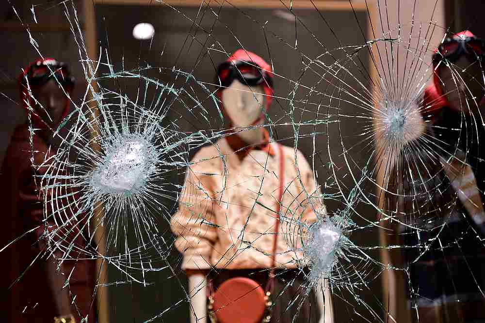 A damaged window of a store is seen as people protest against new restrictions introduced by the government to curb Covid-19 infections, in Turin, Italy October 26, 2020. u00e2u20acu201d Reuters pic