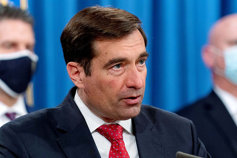 US Assistant Attorney General John Demers speaks at a news conference at the Department of Justice, in Washington October 19, 2020. u00e2u20acu201d Pool pic via Reuters